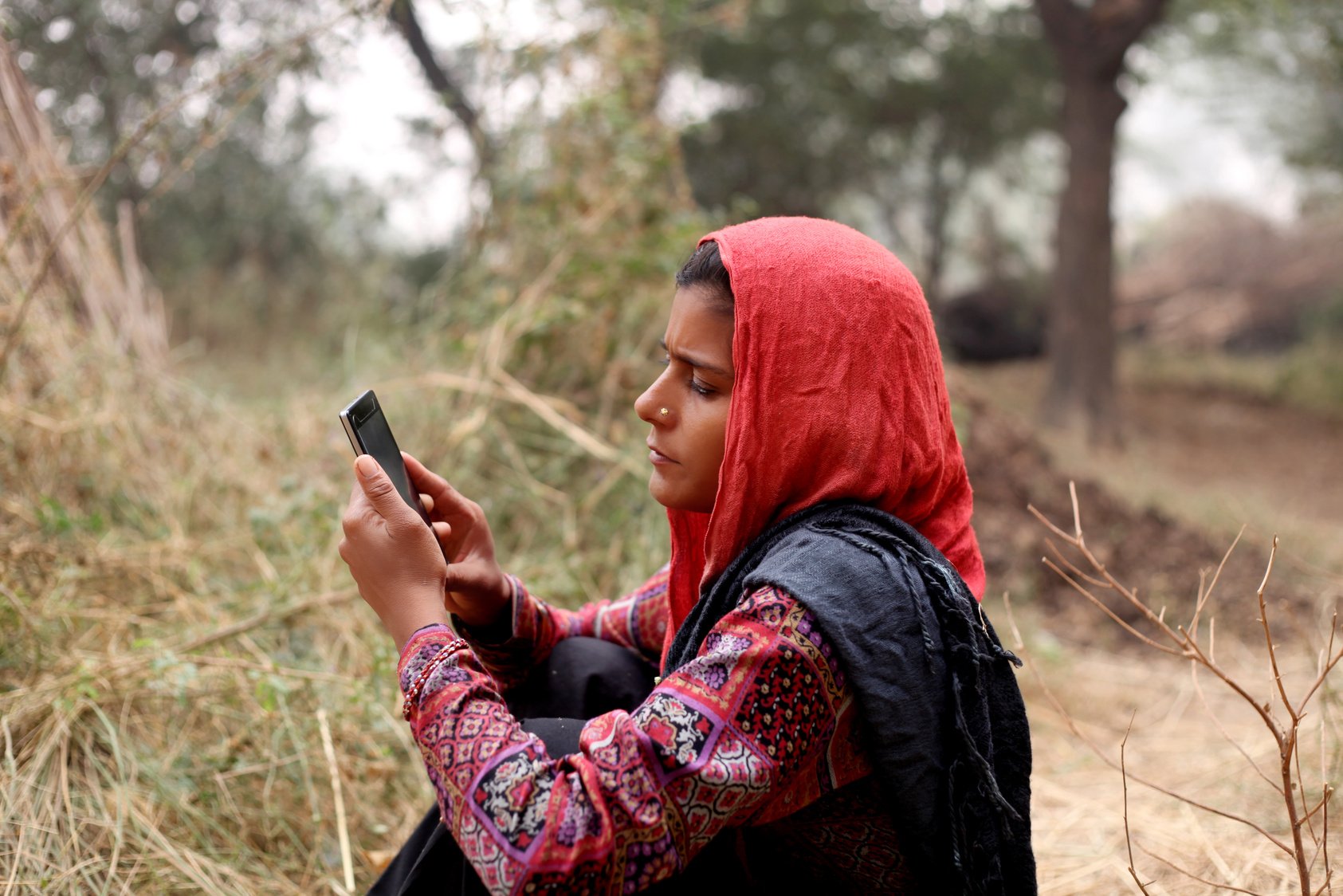 Indian women using mobile phone